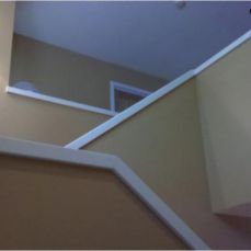 stairway with white railing